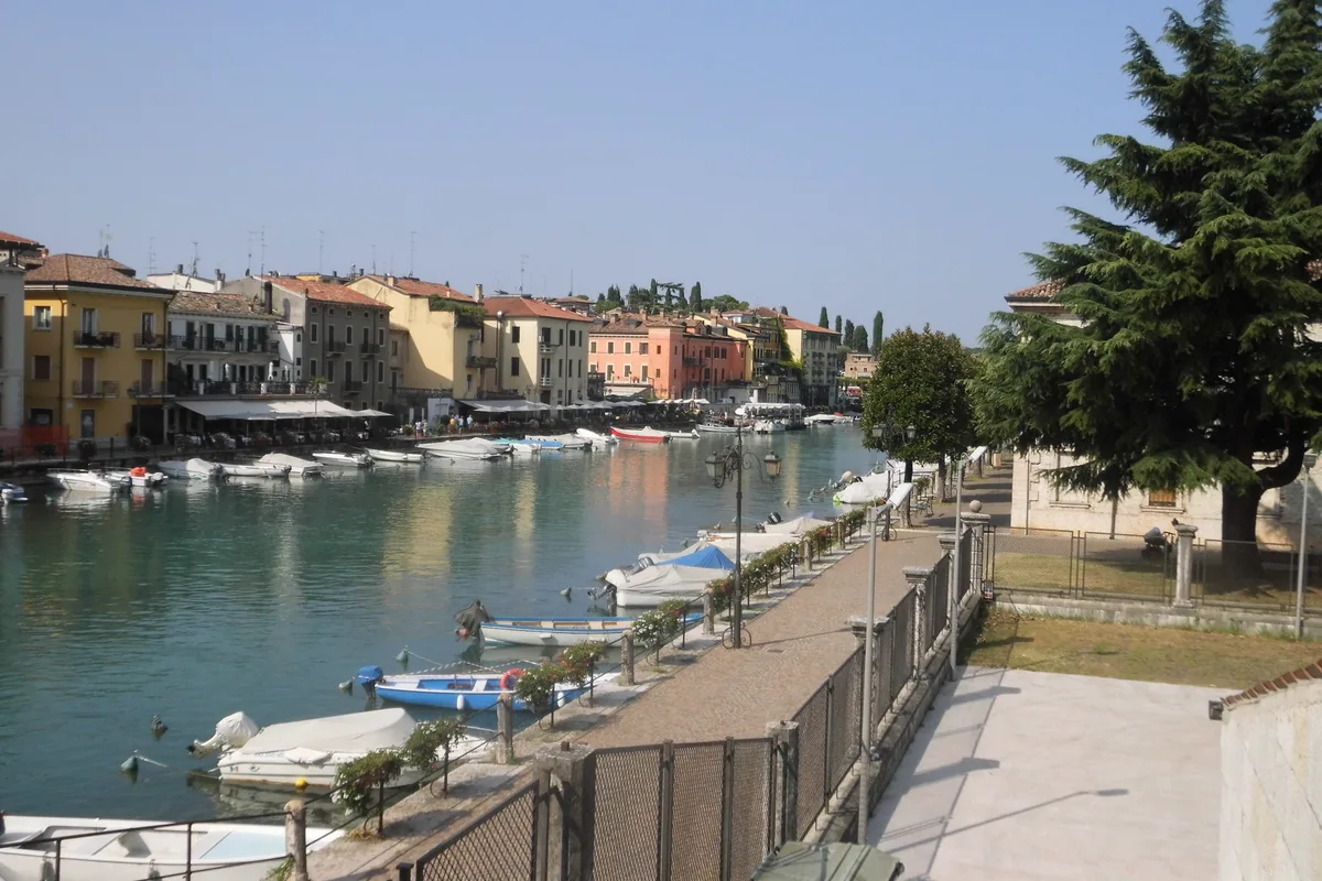 Boats along the waterfront channel in Peschiera del Garda on Lake Garda