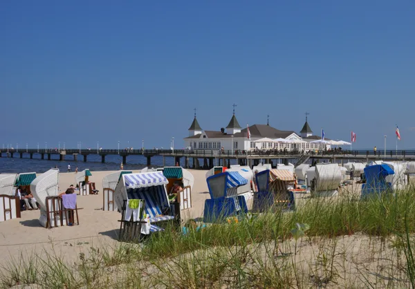 Baltic Sea beach with beach chairs and Ahlbeck pier on the island of Usedom