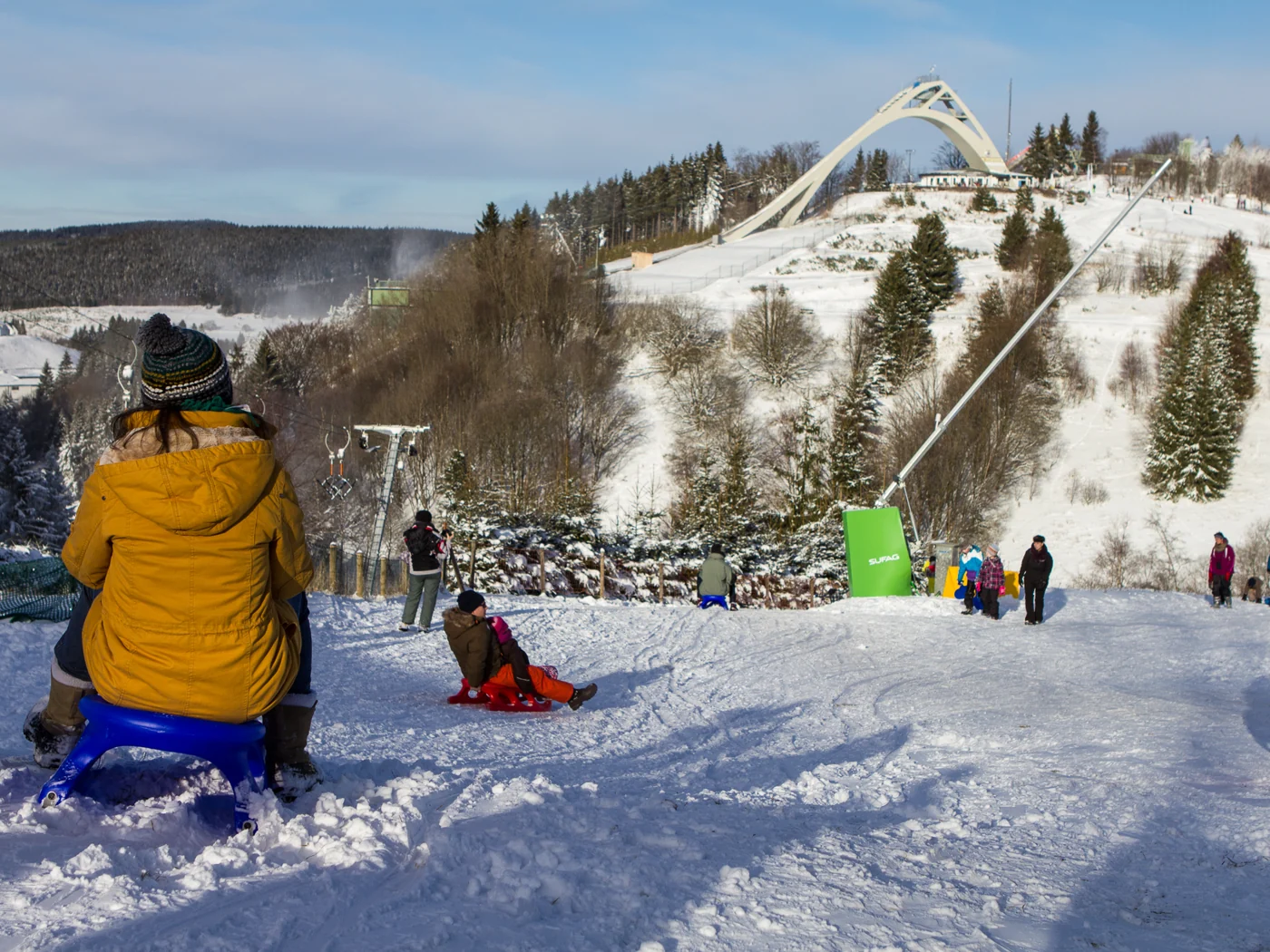 Ski area with snow-covered slopes and winter guests